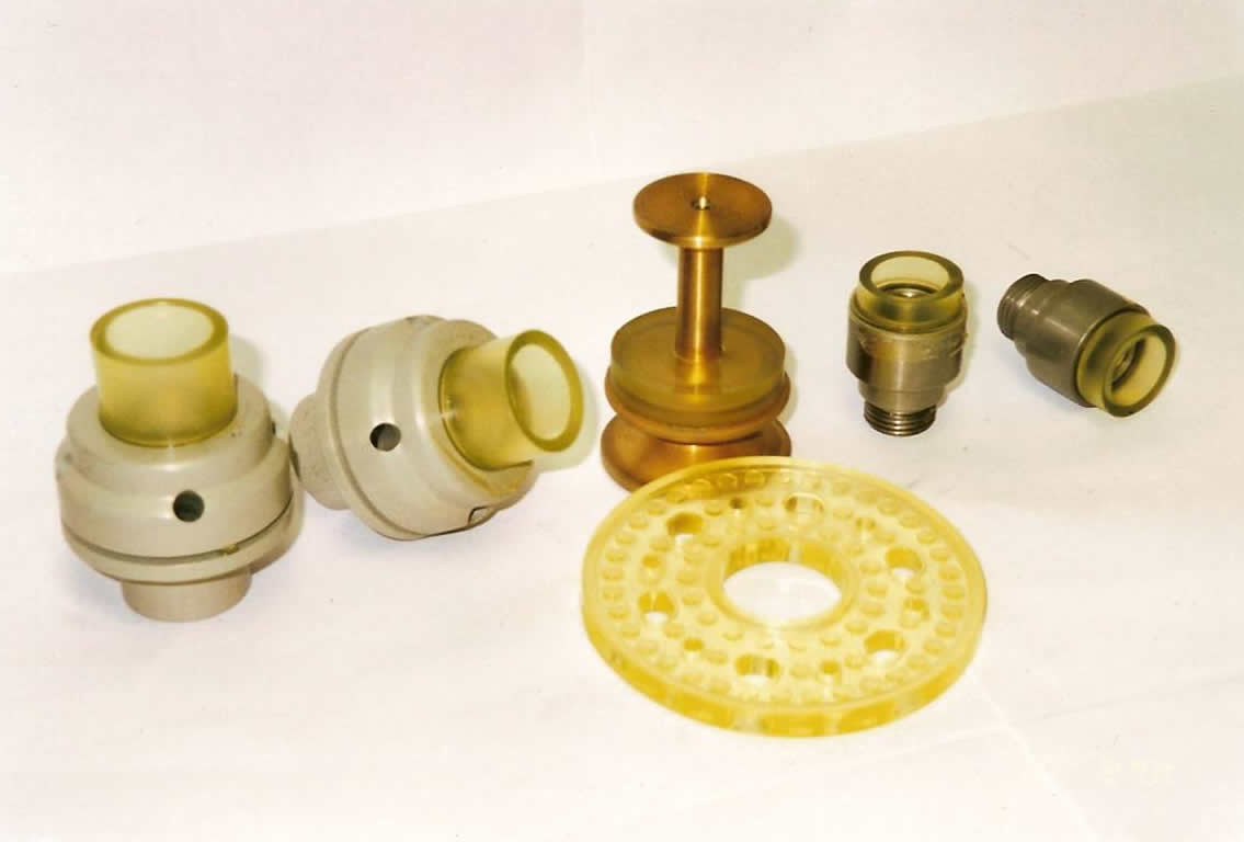 An assortment of custom molded parts displayed.