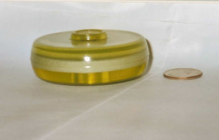 A urethane part by Elastomers' compared to a penny.