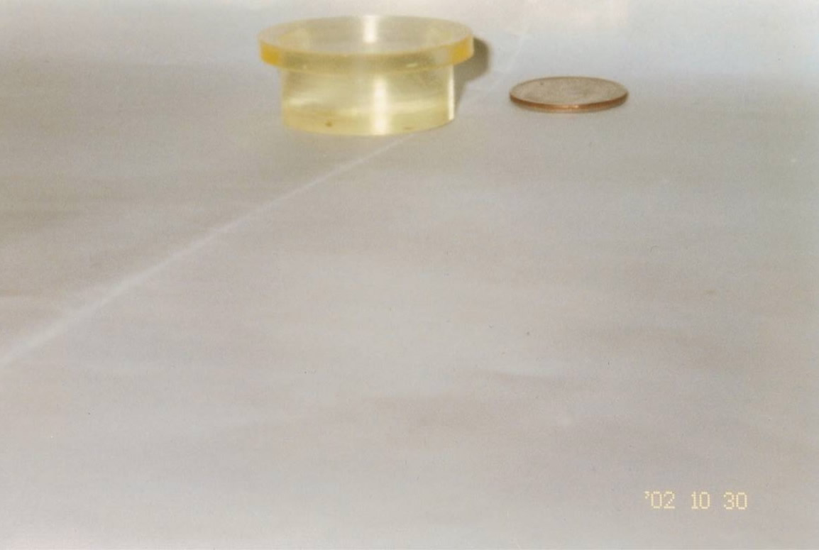 Urethane application being compared to a penny.