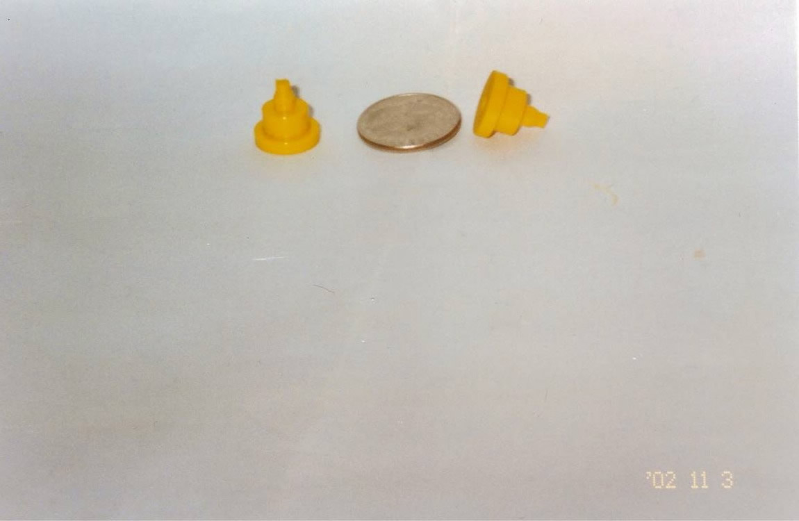 Small cone-like urethane applications shown with a penny.
